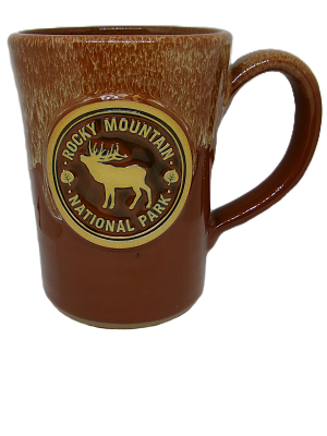 Brown ceramic mug featuring a "Rocky Mountain National Park" emblem with an elk silhouette. Product: Mug - Deneen RMNP Brown Elk.